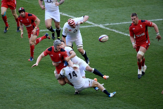 LONDON, ENGLAND - MARCH 09: Jonathan Davies of Wales is tackled by Jack Nowell and Danny Care of England during the RBS Six Nations match between England and Wales at Twickenham Stadium on March 9, 2014 in London, England.  (Photo by David Cannon/Getty Images)