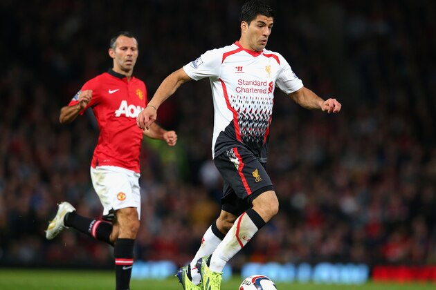 MANCHESTER, ENGLAND - SEPTEMBER 25:  Luis Suarez of Liverpool in action during the Capital One Cup Third Round match betwen Manchester United and Liverpool at Old Trafford on September 25, 2013 in Manchester, England.  (Photo by Julian Finney/Getty Images)