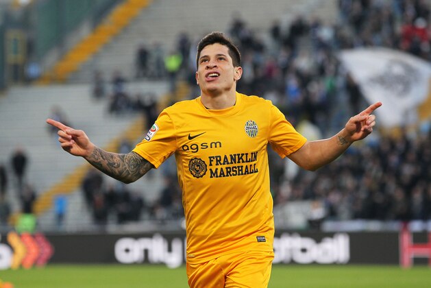 Verona's Juan Manuel Iturbe  celebrates after scoring, during a Serie A soccer match between Udinese and Verona at the Friuli Stadium in Udine, Italy, Monday, Jan. 6, 2014. (AP Photo/Paolo Giovannini)