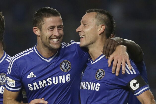 From left to right, Chelsea's Marco Van Ginkel, Gary Cahill and John Terry celebrate after scoring a goal against Indonesia All-Stars during their friendly soccer match at Gelora Bung Karno stadium in Jakarta, Indonesia, Thursday, July 25, 2013. Chelsea won the match 8-1. (AP Photo/Dita Alangkara)