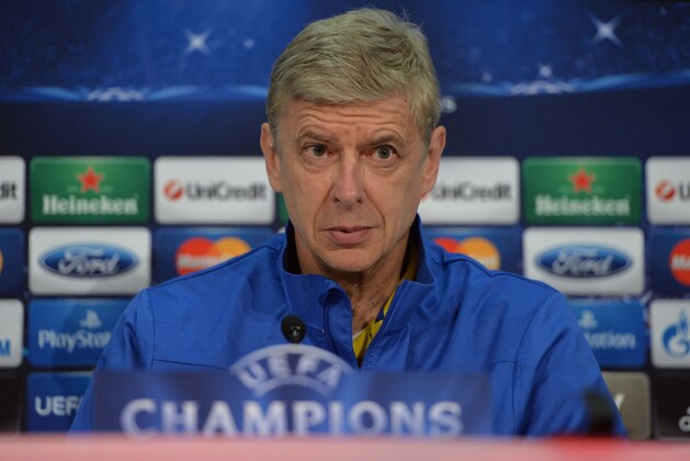Arsenal's  head coach Arsene Wenger attends a press conference in Munich, southern Germany, Monday, March 10, 2014, ahead of their round of 16 second leg Champions League soccer match against FC Bayern on Tuesday. (AP Photo/Kerstin Joensson)