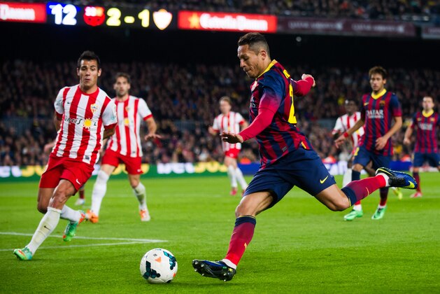 BARCELONA, SPAIN - MARCH 02: Adriano Correia of FC Barcelona and Rafael Ramos 'Rafita' of UD Almeria duel for the ball during the La Liga match between FC Barcelona and UD Almeria at Camp Nou on March 2, 2014 in Barcelona, Spain.  (Photo by Alex Caparros/Getty Images)