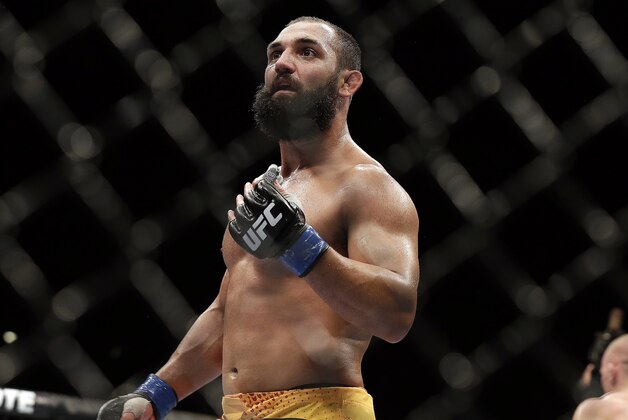 Johny Hendricks walks to his corner during a UFC 167 mixed martial arts championship welterweight bout against Georges St. Pierre, of Canada, on Saturday, Nov. 16, 2013, in Las Vegas. St. Pierre won by split decision. (AP Photo/Isaac Brekken)