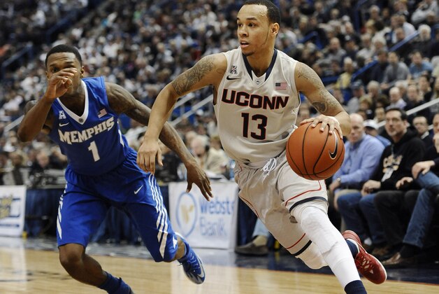 Connecticut's Shabazz Napier, right, drives past Memphis' Joe Jackson during the second half an NCAA college basketball game, Saturday, Feb. 15, 2014, in Hartford, Conn. Connecticut won 86-81. (AP Photo/Jessica Hill)