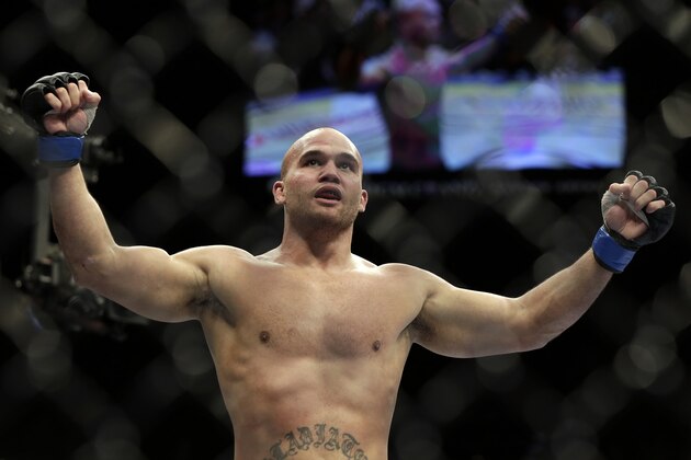 Robbie Lawler celebrates his victory over Rory MacDonald, of Canada, following a UFC 167 mixed martial arts welterweight bout on Saturday, Nov. 16, 2013, in Las Vegas. Lawler won by split decision. (AP Photo/Isaac Brekken)