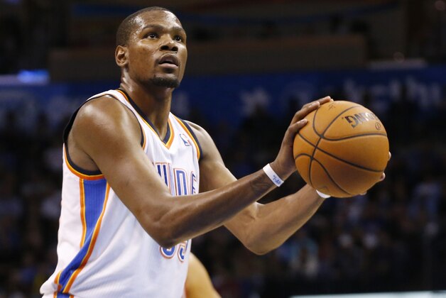 Oklahoma City Thunder forward Kevin Durant (35) shoots a foul shot during an NBA basketball game against the Houston Rockets in Oklahoma City, Tuesday, March 11, 2014. Oklahoma City won 106-98. (AP Photo/Sue Ogrocki)