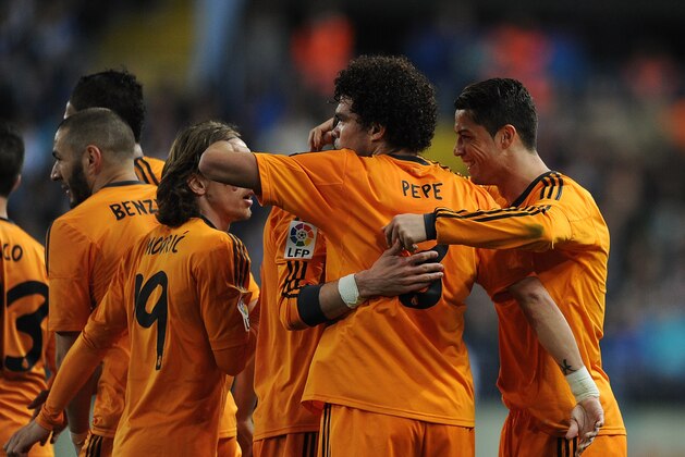 MALAGA, SPAIN - MARCH 15:  Cristiano Ronaldo (R) of Real Madrid celebrates with Pepe after scoring Real's opening goal during the La Liga match between Malaga and Real Madrid at La Rosaleda Stadium on March 15, 2014 in Malaga, Spain.  (Photo by Denis Doyle/Getty Images)