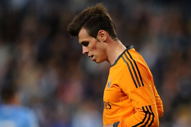 MALAGA, SPAIN - MARCH 15:  Gareth Bale of Real Madrid FC reacts during the La Liga match between Malaga and Real Madrid at La Rosaleda Stadium on March 15, 2014 in Malaga, Spain.  (Photo by Denis Doyle/Getty Images)