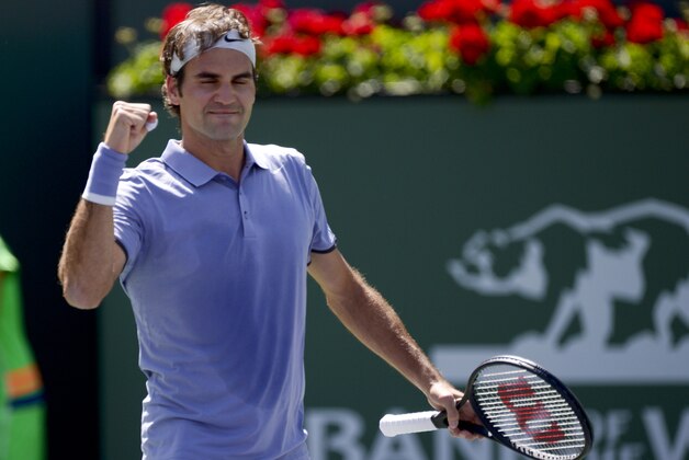Roger Federer, of Switzerland, celebrates his win against Alexandr Dolgopolov, of Ukraine, during their semifinal match at the BNP Paribas Open tennis tournament, Saturday, March 15, 2014, in Indian Wells, Calif. (AP Photo/Mark J. Terrill)