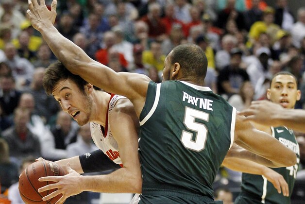 Wisconsin forward Frank Kaminsky drives the ball against Michigan State forward Adreian Payne (5) in the first half of an NCAA college basketball game in the semifinals of the Big Ten Conference tournament Saturday, March 15, 2014, in Indianapolis. (AP Photo/Kiichiro Sato) Wisconsin forward Frank Kaminsky drives the ball against Michigan State forward Adreian Payne (5) in the first half of an NCAA college basketball game in the semifinals of the Big Ten Conference tournament Saturday, March 15, 2014, in Indianapolis. (AP Photo/Kiichiro Sato)