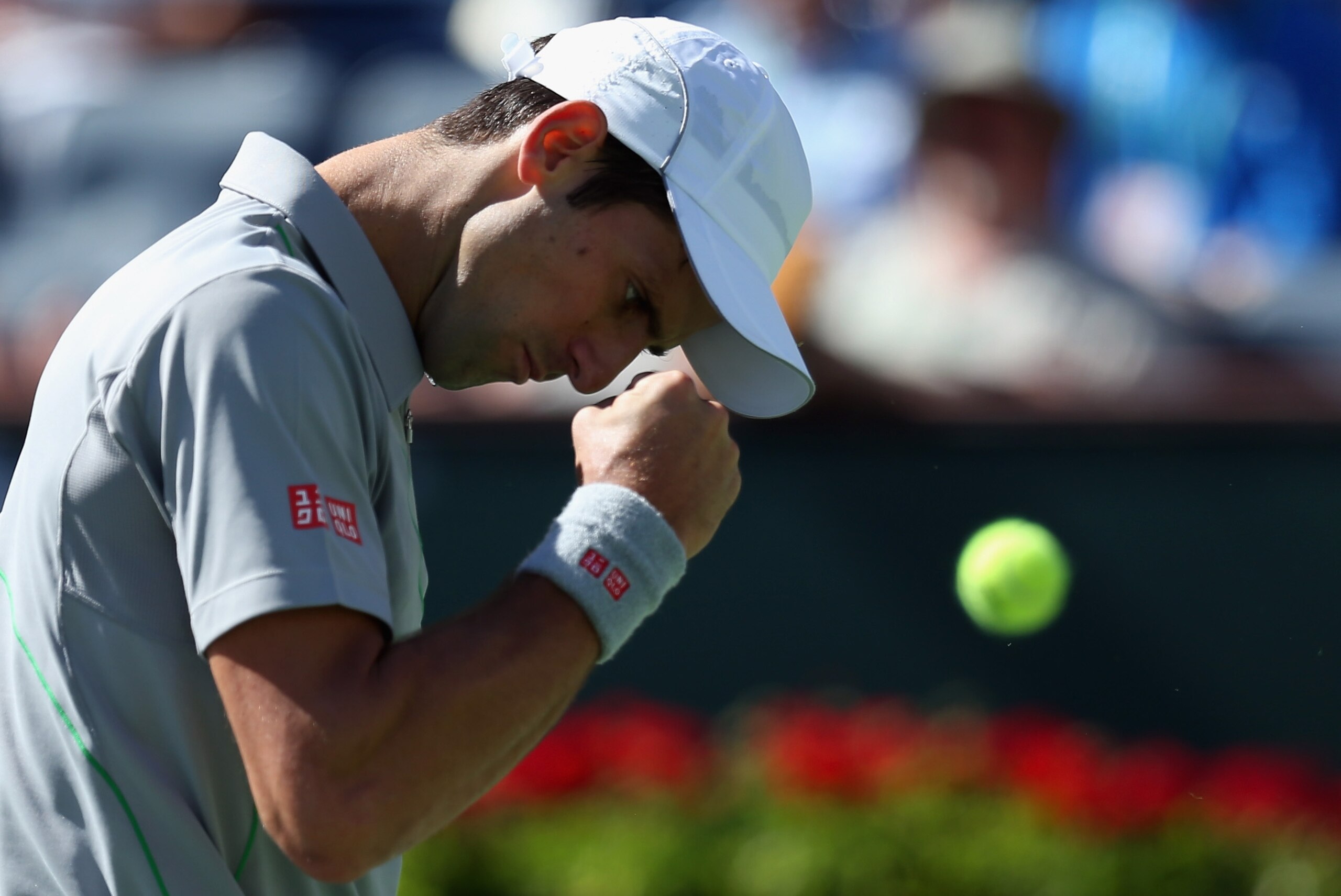 INDIAN WELLS, CA - MARCH 14:  Novak Djokovic of Serbia reacts after winning a point against Julien Benneteau of France during the BNP Paribas Open at Indian Wells Tennis Garden on March 14, 2014 in Indian Wells, California.  (Photo by Jeff Gross/Getty Images)