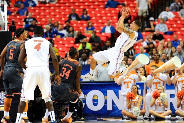 Mar 15, 2014; Atlanta, GA, USA; Florida Gators guard Scottie Wilbekin (5) shoots at the basket against the Tennessee Volunteers during the first half in the semifinals of the SEC college basketball tournament at Georgia Dome. Mandatory Credit: Dale Zanine-USA TODAY Sports