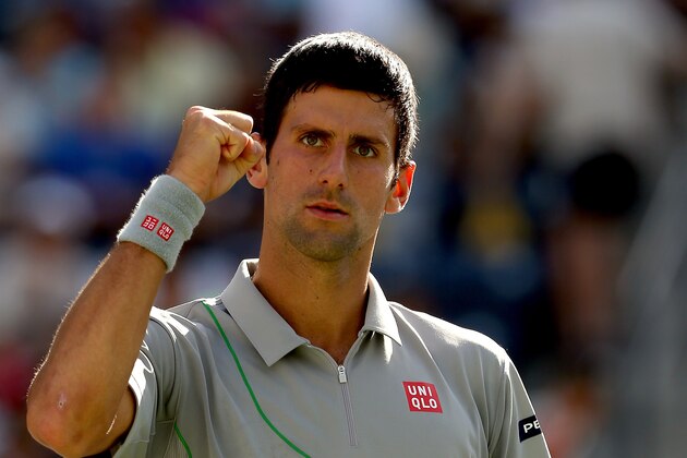 INDIAN WELLS, CA - MARCH 15:  Novak Djokovic of Serbia celerbrates his win over John Isner during the semifinals of the BNP Parabas Open at the Indian Wells Tennis Garden on March 15, 2014 in Indian Wells, California.  (Photo by Matthew Stockman/Getty Images)