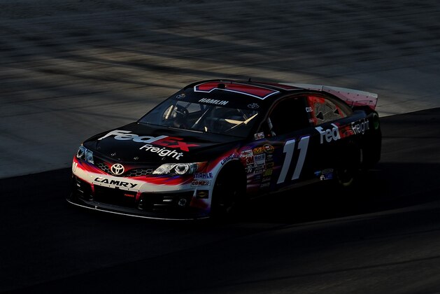BRISTOL, TN - MARCH 15: Denny Hamlin drives the #11 FedEx Freight Toyota during practice for the NASCAR Sprint Cup Series Food City 500 at Bristol Motor Speedway on March 15, 2014 in Bristol, Tennessee.  (Photo by Will Schneekloth/Getty Images)
