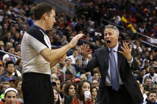 Philadelphia 76ers head coach Brett Brown, right, yells for a timeout to referee Brent Barnaky during the second half of an NBA basketball game against the Indiana Pacers, Friday, March 14, 2014, in Philadelphia. Indiana won 101-94. (AP Photo/Matt Slocum)