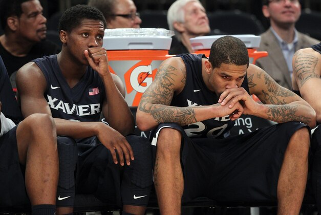 Mar 14, 2014; New York, NY, USA; Xavier Musketeers guard Brandon Randolph (3) and forward Justin Martin (20) react on the bench during the second half of a semifinal game of the Big East college basketball tournament against the Creighton Bluejays at Madison Square Garden. Creighton defeated Xavier 86-78. Mandatory Credit: Brad Penner-USA TODAY Sports