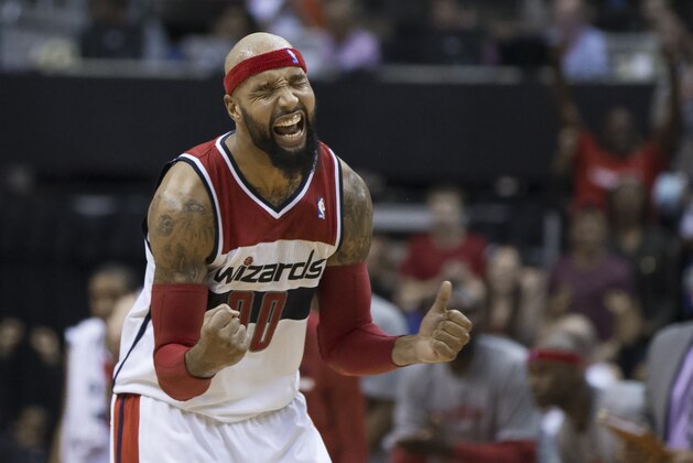 Washington Wizards forward Drew Gooden celebrates a basket during the second half of an NBA basketball game against the Brooklyn Nets on Saturday, March 15, 2014, in Washington. The Wizards defeated the Nets 101-94. (AP Photo/ Evan Vucci)