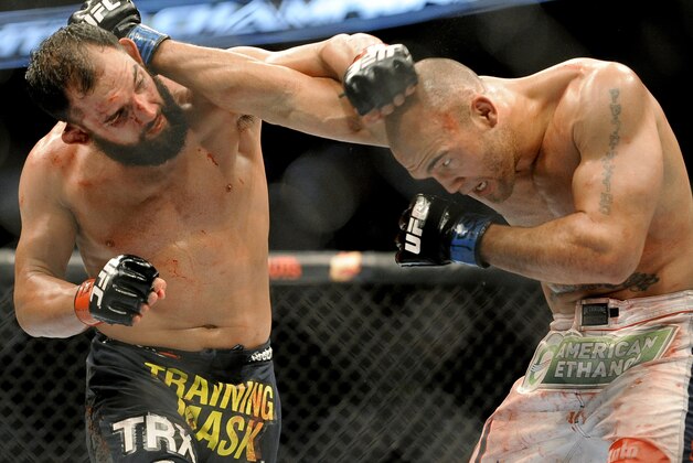 Johny Hendricks, left, and Robbie Lawler exchange punches during a UFC 171 mixed martial arts welterweight title bout, Saturday, March 15, 2014, in Dallas. Hendricks won by decision. (AP Photo/Matt Strasen) Johny Hendricks, left, and Robbie Lawler exchange punches during a UFC 171 mixed martial arts welterweight title bout, Saturday, March 15, 2014, in Dallas. Hendricks won by decision. (AP Photo/Matt Strasen)