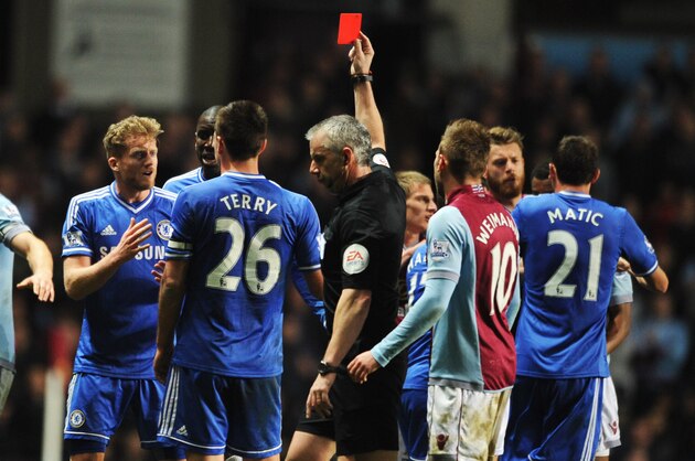 BIRMINGHAM, ENGLAND - MARCH 15:  Ramires of Chelsea (3L) is shown a red card and is sent off by referee Chris Foy after a challenge on Karim El Ahmadi of Aston Villa (L) during the Barclays Premier League match between Aston Villa and Chelsea at Villa Park on March 15, 2014 in Birmingham, England.  (Photo by Chris Brunskill/Getty Images)