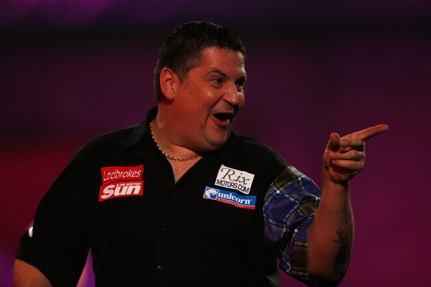 LONDON, ENGLAND - DECEMBER 28:  Gary Anderson of Scotland in action during his third round match against Michael van Gerwen of Holland on day thirteen of the Ladbrokes.com World Darts Championship at Alexandra Palace on December 28, 2013 in London, England.  (Photo by Harry Engels/Getty Images)