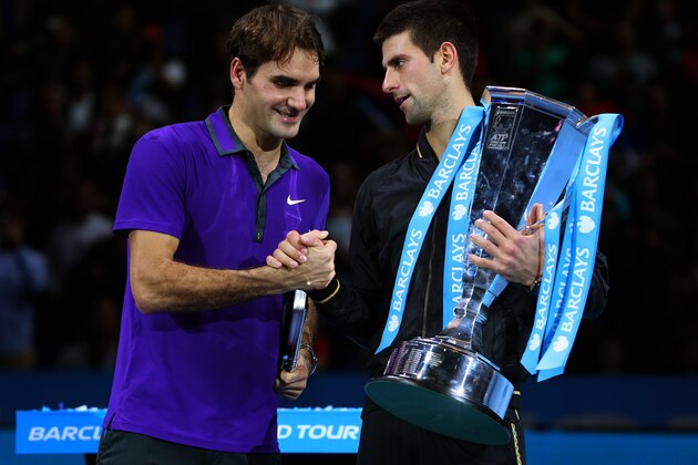 LONDON, ENGLAND - NOVEMBER 12:  Novak Djokovic of Serbia shakes hands with  Roger Federer of Switzerland as he holds the trophy following their men's singles final match against Roger Federer of Switzerland during day eight of the ATP World Tour Finals at O2 Arena on November 12, 2012 in London, England.  (Photo by Julian Finney/Getty Images)