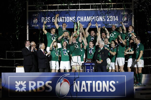 Ireland's rugby team players celebrate after defeating France and winning the Six Nations Rugby Union tournament at the stade de France stadium, in Saint Denis, outside Paris, Saturday, March 15, 2014. (AP Photo/Christophe Ena)