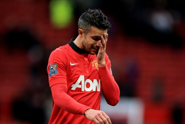 MANCHESTER, ENGLAND - DECEMBER 07:  A dejected Robin van Persie of Manchester United walks off the pitch following his team's 1-0 defeat during the Barclays Premier League match between Manchester United and Newcastle United at Old Trafford on December 7, 2013 in Manchester, England.  (Photo by Richard Heathcote/Getty Images)