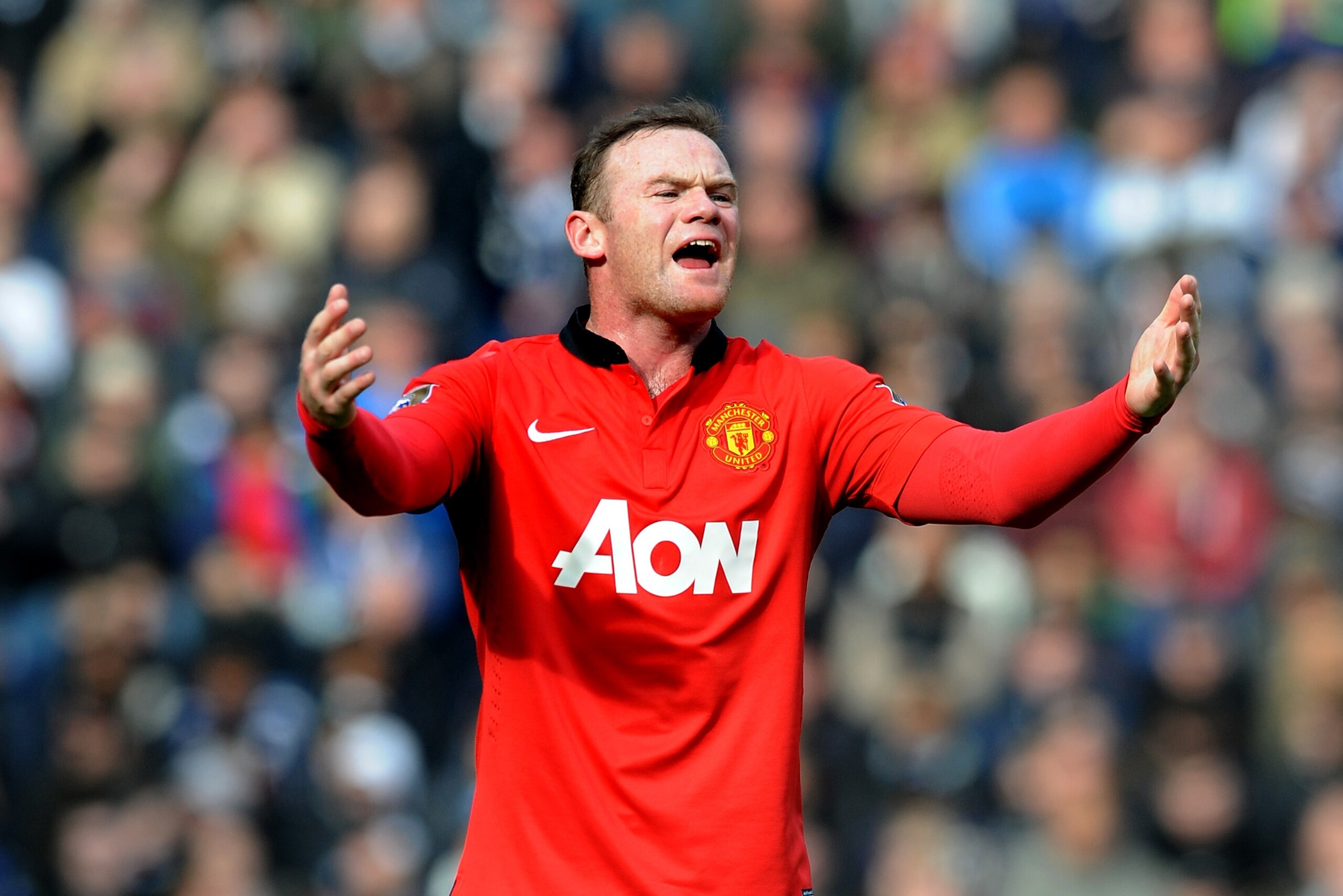 Manchester United's Wayne Rooney shouts instructions to team mates during the English Premier League soccer match between West Bromwich Albion and Manchester United at The Hawthorns Stadium in West Bromwich, England, Saturday, March 8, 2014.  (AP Photo/Rui Vieira)