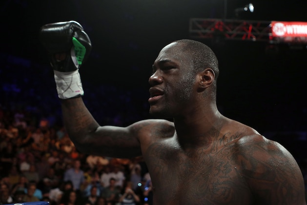 WBC Continental Americas Heavyweight Champion Deontay Wilder celebrates after defeating by KO in the first round Malik Scott during their heavyweight bout at the Ruben Rodriguez Coliseum in Bayamon, Puerto Rico, Saturday, March 15, 2014. (AP Photo/Ricardo Arduengo)