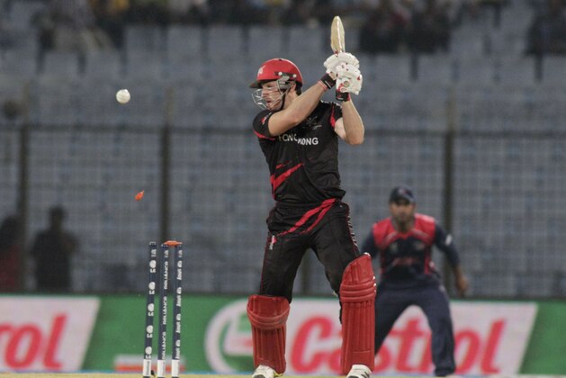 Hong Kong captain Jamie Atkinson is bowled out during their ICC Twenty20 Cricket World Cup match against Nepal in Chittagong, Bangladesh, Sunday, March 16, 2014. (AP Photo/Bikas Das)