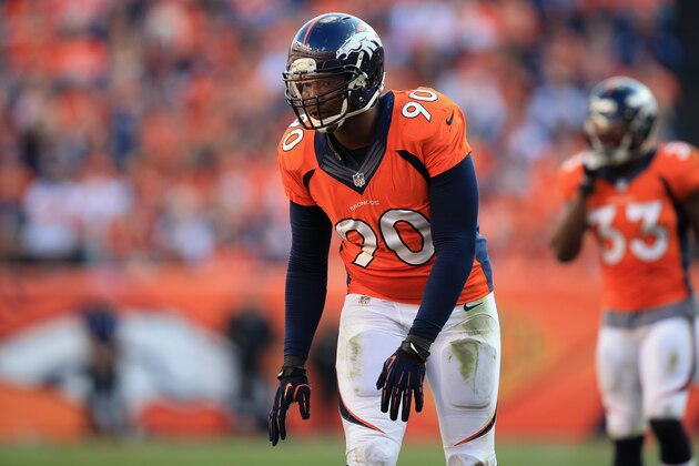 DENVER, CO - OCTOBER 13:  Defensive end Shaun Phillips #90 of the Denver Broncos defends against the Jacksonville Jaguars at Sports Authority Field at Mile High on October 13, 2013 in Denver, Colorado. The Broncos defeated the Jaguars 35-19.  (Photo by Doug Pensinger/Getty Images)