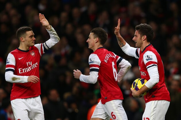 LONDON, ENGLAND - DECEMBER 29:  Olivier Giroud of Arsenal celebrates scoring their sixth goal with Thomas Vermaelen of Arsenal during the Barclays Premier League match between Arsenal and Newcastle United at the Emirates Stadium on December 29, 2012 in London, England.  (Photo by Clive Mason/Getty Images)