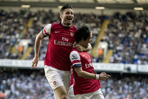 Arsenal's Tomas Rosicky, right, celebrates scoring with teammate Olivier Giroud during the English Premier League soccer match between Tottenham Hotspur and Arsenal at White Hart Lane stadium in London, Sunday, March 16, 2014. (AP Photo/Matt Dunham) Arsenal's Tomas Rosicky, right, celebrates scoring with teammate Olivier Giroud during the English Premier League soccer match between Tottenham Hotspur and Arsenal at White Hart Lane stadium in London, Sunday, March 16, 2014. (AP Photo/Matt Dunham)