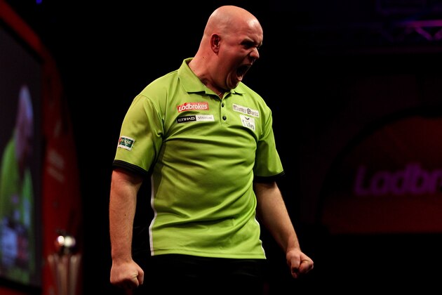 LONDON, ENGLAND - JANUARY 01:  Michael van Gerwen of The Netherlands celebrates after winning a set during the final of the Ladbrokes.com World Darts Championships at Alexandra Palace on January 1, 2014 in London, England.  (Photo by Ben Hoskins/Getty Images)