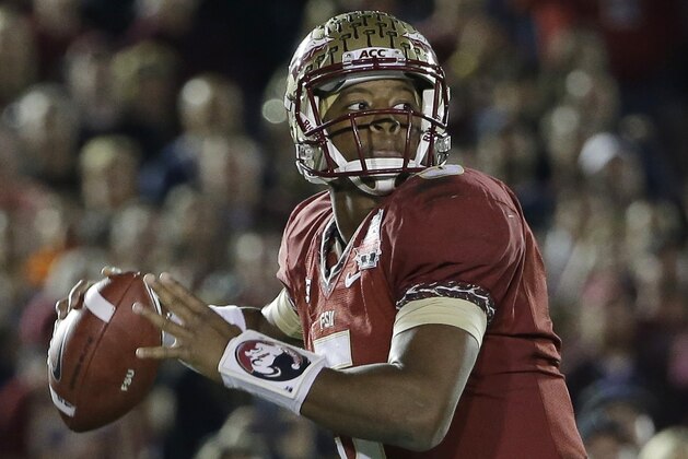 Florida State's Jameis Winston (5) throws during the first half of the NCAA BCS National Championship college football game against Auburn Monday, Jan. 6, 2014, in Pasadena, Calif.(AP Photo/David J. Phillip)