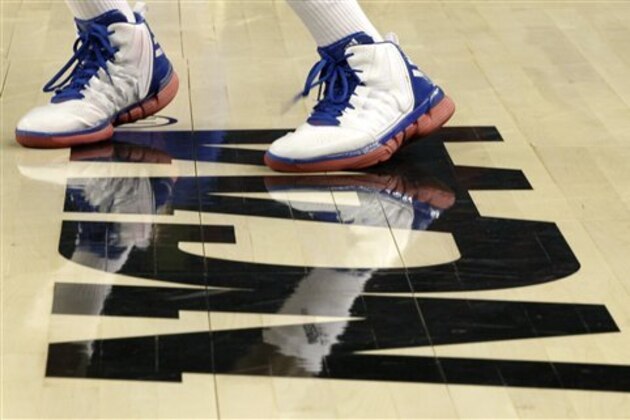 A players shoes are seen on the NCAA logo during Kansas' practice session for the NCAA Final Four basketball tournament Friday, March 30, 2012, in New Orleans. Kansas plays Ohio State in a semifinal game on Saturday. (AP Photo/Mark Humphrey) A players shoes are seen on the NCAA logo during Kansas' practice session for the NCAA Final Four basketball tournament Friday, March 30, 2012, in New Orleans. Kansas plays Ohio State in a semifinal game on Saturday. (AP Photo/Mark Humphrey)