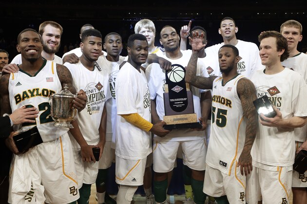 Baylor's Pierre Jackson (55) and A.J. Walton (22) celebrate with teammates after the NIT championship college basketball game against Iowa on Thursday, April 4, 2013, in New York. Baylor won 74-54. (AP Photo/Frank Franklin II)