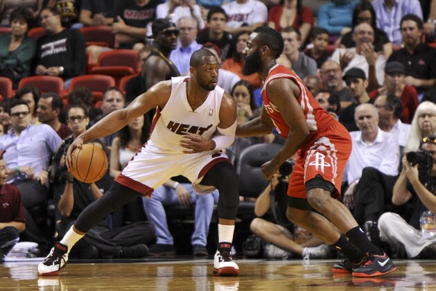 Mar 16, 2014; Miami, FL, USA; Miami Heat guard Dwyane Wade (3) is pressured by Houston Rockets guard James Harden (13) during the first half at the American Airlines Arena. Mandatory Credit: Steve Mitchell-USA TODAY Sports Mar 16, 2014; Miami, FL, USA; Miami Heat guard Dwyane Wade (3) is pressured by Houston Rockets guard James Harden (13) during the first half at the American Airlines Arena. Mandatory Credit: Steve Mitchell-USA TODAY Sports