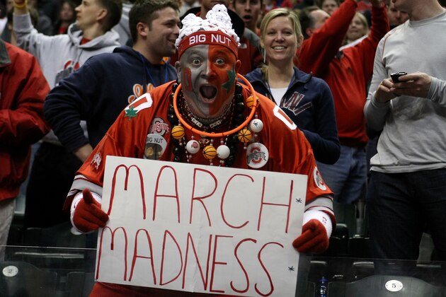 INDIANAPOLIS, IN - MARCH 13:  John 'Big Nut' Peters, fan of the Ohio State Buckeyes holds up a sign which reads 'March Madness' after they won 71-60 against the Penn State Nittany Lions during the championship game of the 2011 Big Ten Men's Basketball Tournament at Conseco Fieldhouse on March 13, 2011 in Indianapolis, Indiana.  (Photo by Chris Chambers/Getty Images)