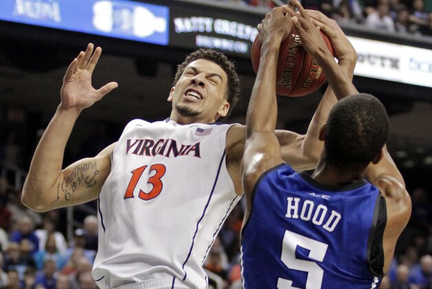 Virginia's Anthony Gill (13) and Duke's Rodney Hood (5) battle for a rebound during the second half of an NCAA college basketball game in the championship of the Atlantic Coast Conference tournament in Greensboro, N.C., Sunday, March 16, 2014. (AP Photo/Bob Leverone) Virginia's Anthony Gill (13) and Duke's Rodney Hood (5) battle for a rebound during the second half of an NCAA college basketball game in the championship of the Atlantic Coast Conference tournament in Greensboro, N.C., Sunday, March 16, 2014. (AP Photo/Bob Leverone)