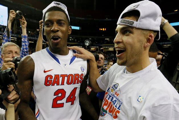 ATLANTA, GA - MARCH 16:  Scottie Wilbekin #5 and Casey Prather #24 of the Florida Gators celebrate their 61 to 60 win over the Kentucky Wildcats in the Championship game of the 2014 Men's SEC Basketball Tournament at Georgia Dome on March 16, 2014 in Atlanta, Georgia.  (Photo by Kevin C. Cox/Getty Images)
