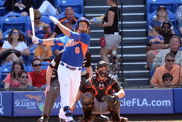 Mar 1, 2014; Port St. Lucie, FL, USA; New York Mets center fielder Matt den Dekker (6) and Miami Marlins catcher Rob Brantly (19) watch the ball in the spring training game at Tradition Stadium. Mandatory Credit: Brad Barr-USA TODAY Sports