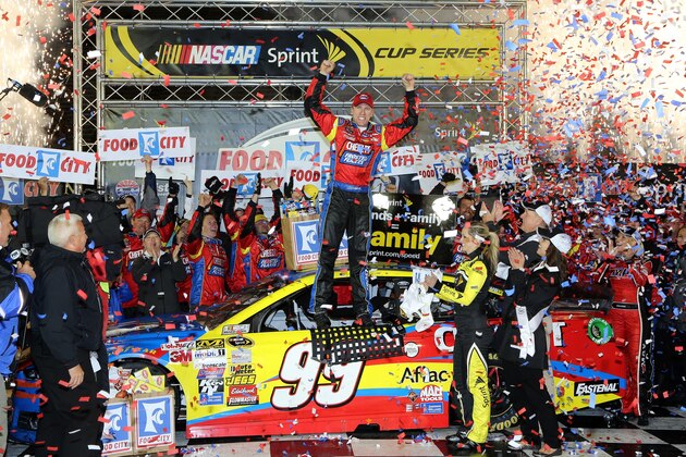 BRISTOL, TN - MARCH 16:  Carl Edwards, driver of the #99 Kellogg's / Frosted Flakes Ford, celebrates in Victory Lane after taking the checkered flag under caution to win the NASCAR Sprint Cup Series Food City 500 at Bristol Motor Speedway on March 16, 2014 in Bristol, Tennessee.  (Photo by Jerry Markland/Getty Images)