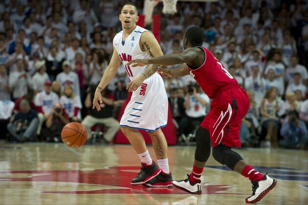 DALLAS, TX - FEBRUARY 5: Nic Moore #11 of the SMU Mustangs is defended by Chris Jones #3 of the Louisville Cardinals on February 5, 2014 at Moody Coliseum in Dallas, Texas.  (Photo by Cooper Neill/Getty Images)