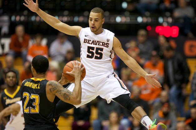 Dec 18, 2013; Corvallis, OR, USA; Oregon State Beavers guard Roberto Nelson (55) defends a pass from Towson Tigers guard Mike Burwell (23) in the first half at Gill Coliseum. Mandatory Credit: Jaime Valdez-USA TODAY Sports