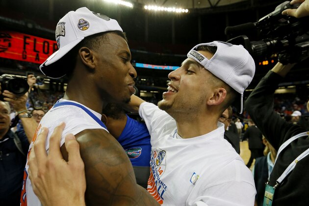 ATLANTA, GA - MARCH 16:  Scottie Wilbekin #5 and Casey Prather #24 of the Florida Gators celebrate their 61 to 60 win over the Kentucky Wildcats in the Championship game of the 2014 Men's SEC Basketball Tournament at Georgia Dome on March 16, 2014 in Atlanta, Georgia.  (Photo by Kevin C. Cox/Getty Images)