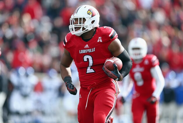 LOUISVILLE, KY - NOVEMBER 23:  Preston Brown #2 of the Louisville Cardinals returns a fumble for a touchdown during the game against the Memphis Tigers at Papa John's Cardinal Stadium on November 23, 2013 in Louisville, Kentucky.  (Photo by Andy Lyons/Getty Images)