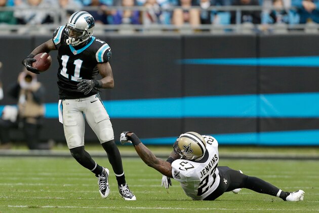 Carolina Panthers' Brandon LaFell (11) controls the catch and turns away from New Orleans Saints' Malcolm Jenkins (27) during the second half an NFL football game in Charlotte, N.C., Sunday, Dec. 22, 2013. The Panthers won 17-13. (AP Photo/Bob Leverone)