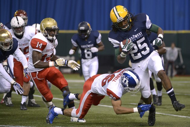 West defensive back Marcus Williams (25), of North Dakota State, is tackled by East defensive back Ross Cockrell (26), of Duke, after retuning a kick during the second half of the East-West Shrine Classic NCAA football game in St. Petersburg, Fla., Saturday, Jan. 18, 2014.(AP Photo/Phelan M. Ebenhack)