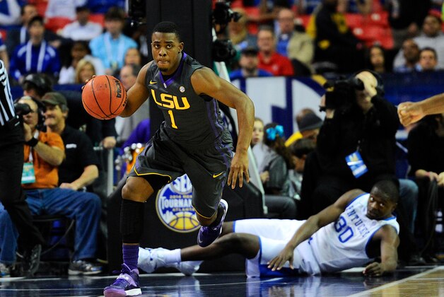 Mar 14, 2014; Atlanta, GA, USA; LSU Tigers guard Anthony Hickey (1) heads up court leaving Kentucky Wildcats forward Julius Randle (30) on the floor behind him during the first half in the quarterfinals of the SEC college basketball tournament at Georgia Dome.  Mandatory Credit: Dale Zanine-USA TODAY Sports